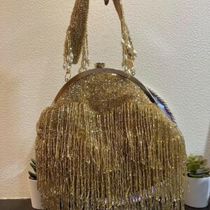 golden clutchbag with framing