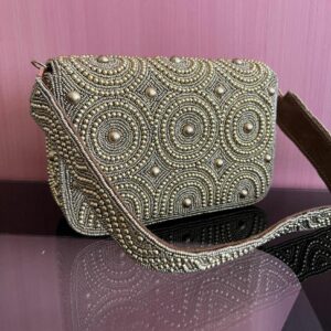 Golden handcrafted flap clutchbag