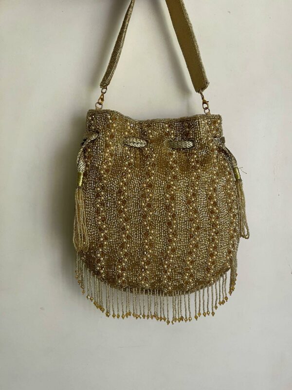 golden tassels and beaded potli