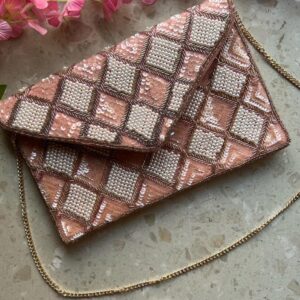 Rose gold sequins and pearl clutch bag