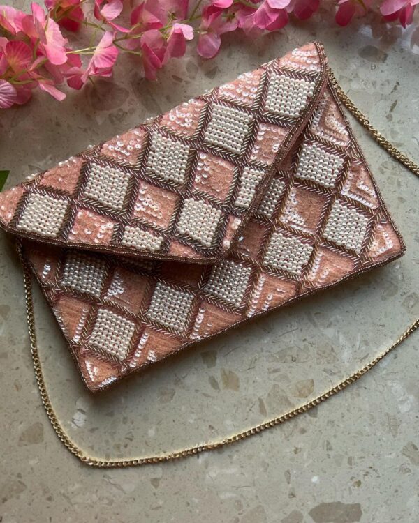 Rose gold sequins and pearl clutch bag