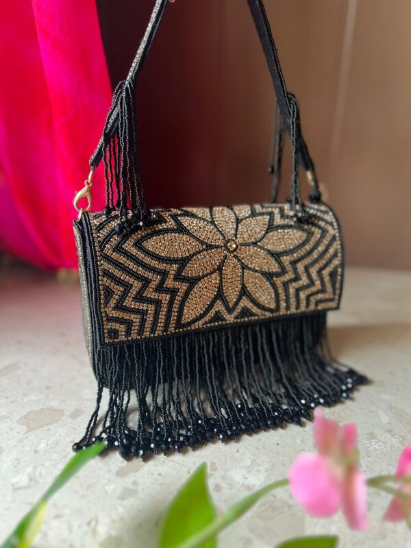 Tassels handcrafted evening clutch bag