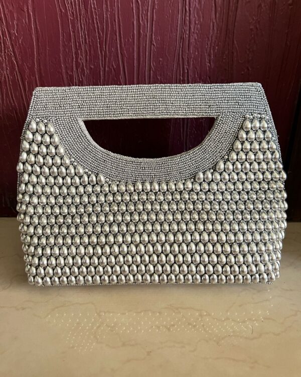 Pearl drops clutch bag